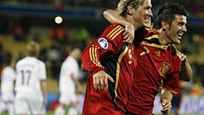 Fernando Torres, left, is hugged by David Villa after he scores his hat-trick goal against New Zealand.