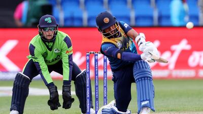 Kusal Mendis plays a shot over the boundary for six as Sri Lanka win the T20 World Cup match against Ireland at Bellerive Oval in Hobart on October 23, 2022. AFP