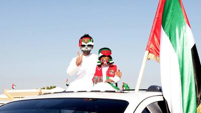 Children joined in the fun during the car parade near the Clock roundabout in UAQ. Jeffrey E Biteng / The National