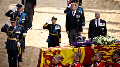 King Charles III, Prince William and Princess Anne salute alongside Prince Harry and Prince Andrew, as the coffin of Queen Elizabeth II arrives at the Palace of Westminster, following a procession from Buckingham Palace. AFP