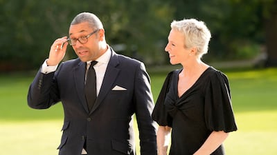 Britain's Foreign Secretary James Cleverly arrives at Buckingham Palace in London with his wife Susannah for the reception. AFP
