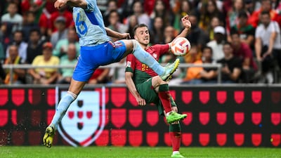 Portugal forward Diogo Jota and Spain midfielder Rodri challenge for the ball. Getty