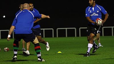 Mohannad Shaker, right, trains with the national team last night in Dubai. The Emirati will be among the replacements on Saturday.