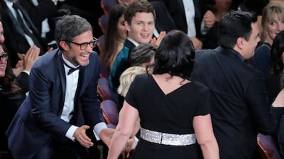 Gael Garcia Bernal looks delighted as Kristen Anderson-Lopez and Robert Lopez win the Oscar for Best Original Song, 'Remember Me,' from 'Coco.' Ansel Engort appears to be suffering from 'FOMO'. Reuters