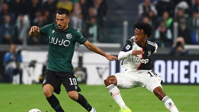 Nicola Sansone of Bologna FC competes for the ball with Juan Cuadrado of Juventus FC during the Serie A match between Juventus and Bologna FC at Allianz Stadium in Turin, Italy. Getty Images