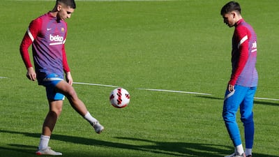 Barcelona's Ferran Torres and Pedri during training. Reuters