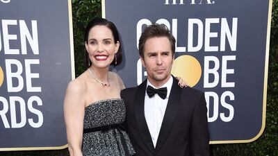 Leslie Bibb, left, and Sam Rockwell, wearing Prada, arrive at the 77th annual Golden Globe Awards at the Beverly Hilton Hotel on January 5, 2020. AP