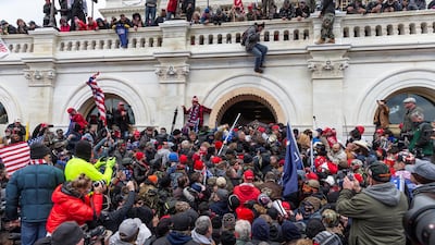 Rioters clash with police while trying to enter the Capitol building on January 6, 2021. Reuters