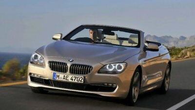 The click-in, fold-down wind blocker is not as elegant a solution as the body shape or the interior deserves.