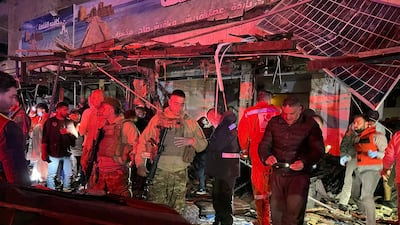 Lebanese soldiers gather at the site of an Israeli strike that hit a vehicle in Sidon. AFP