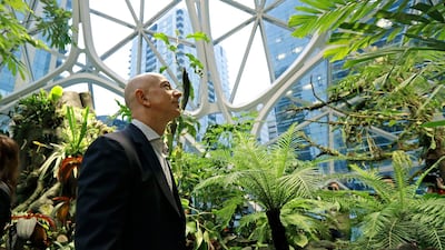 Jeff Bezos, the CEO and founder of Amazon.com, takes a walking tour of the Amazon Spheres in Seattle. Bezos said Monday, February 17, 2020, that he plans to spend $10 billion of his own fortune to help fight climate change. AP Photo