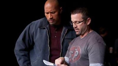 The actor Dwayne Johnson, left, and the director Ric Roman Waugh on the set of Snitch.
