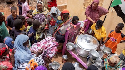 Meals are distributed at a community kitchen in Omdurman, Sudan. The UN estimates 30 million people in the country will need assistance this year. Reuters