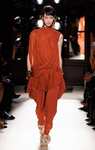 A beautifully draped look in mahogany brown by Balmain for spring 2026. Photo: Balmain