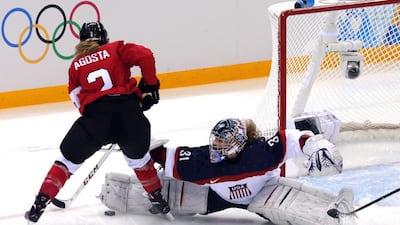 Meghan Agosta, left, celebrated her 27 birthday with a pair of goals to lift Canada over the United States 3-2 in round-robin segment of the women's ice hockey competition at the Sochi Olympics. Anatoly Maltsev / EPA