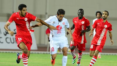 Manuel Lanzini, centre, of Al Jazira in action during a pre-season friendly against East Riffa on September 1. 2014. Courtesy Al Jazira