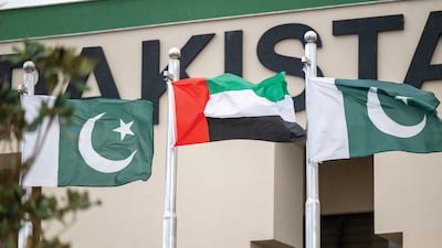 Emirati and Pakistani flags fly