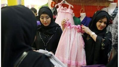 Aspiring businesswomen Muna Walid, left, and Noor Askar display their offerings.