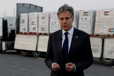US Secretary of State Antony Blinken in front of a lorry carrying humanitarian aid for Gaza at the Jordanian Hashemite Charity Organisation in Amman. Reuters