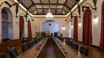 Police examine damage at a conference hall during an investigation at the President's Palace in Colombo, Sri Lanka. Bloomberg
