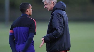 Prolonged discussions with Theo Walcott, left, has left Arsene Wenger frustrated.