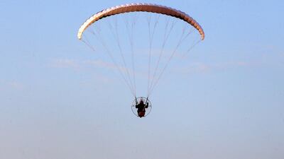 A Saudi youth flies a powered parachute in al-Thumama park in Riyadh, Saudi Arabia. Reuters