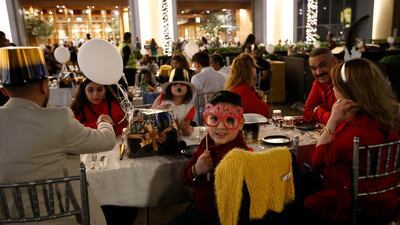 People gather near to Burj Khalifa prior to the fireworks. EPA
