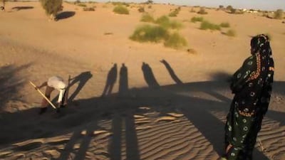 Ani Boka Arby watches and weeps as the body of her husband, Mohamed Lamine is unearthed near Timbuktu.