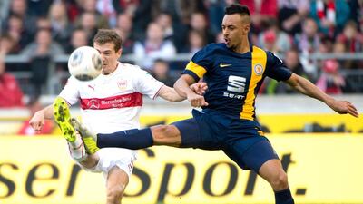 Stuttgart’s Daniel Schwaab, left, challenges for the ball with Braunschweig’s Karim Bellarabi, during the German Bundesliga soccer match between VfB Stuttgart and Eintracht Braunschweig in Stuttgart, southern Germany, Saturday March 8, 2014. Sebastian Kahnert/AFP