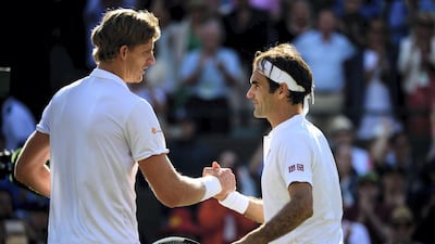 Kevin Anderson shakes hands with Roger Federer after coming from two sets down to beat the seven-time major winner at Wimbledon in July. Getty