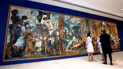 The auction house expects Sarajevo, a 10-metre long and three-metre high oil on canvas painting by Egyptian artist Omar El Nagdi, is expected to fetch between Dh1.5 million and Dh2.2m during its Dubai season. Marwan Naamani / AFP