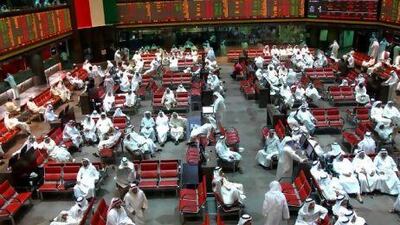 Traders at the Kuwait Stock Exchange where the index rose slightly.