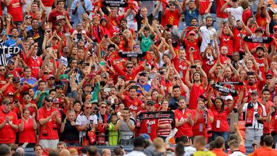 Fans of Manchester United support their team as they walk off the field after an International Champions Cup match against AS Roma on Saturday. Justin Edmonds / Getty Images / AFP