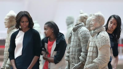 Mrs Obama with her daughters Malia Obama, right and Sasha Obama, centre, and mother Marian Robinson visit Museum of Terracotta Warriors. “Education is an important focus for me. It’s personal,” Mrs Obama said. Feng Li / Getty Images March 24
