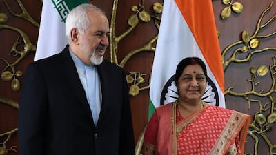 Indian Foreign Minister Sushma Swaraj (R) poses for photos with Iran's Foreign Minister Mohammad Javad Zarif prior to a meeting in New Delhi on May 14, 2019. AFP