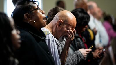 People gather for a vigil near the scene where a container ship collided with a support column on the Francis Scott Key Bridge, at Mount Olive Baptist Church in Dundalk, Maryland. AP