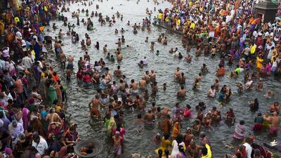 Hindu devotees take a holy dip in the River Godavari on the first official day of bathing as part of Kumbh Mela celebrations in Nasik, India. Hindus believe that sins accumulated in past and current lives require them to continue the cycle of death and rebirth until they are cleansed. Bathing in sacred waters on the most auspicious day of the Kumbh festival, or Pitcher Festival, believers say rids them of their sins. Bernat Armangue / AP