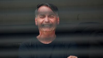 Brazil's former President Jair Bolsonaro reacts at his home while under house arrest, ordered by Supreme Court Justice Alexandre de Moraes, as he awaits trial over an alleged plot to overturn the 2022 election, in Brazil. Reuters