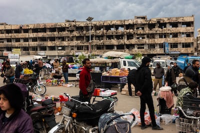 Syrians visit a market in the city of Homs, home to a large Alawite community. Getty