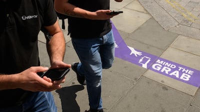 Signs warning people of the high risk of phone thefts in London. Getty Images