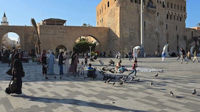 Libyans walk around in Tripoli's Martyrs Square on April 28, 2025. AFP