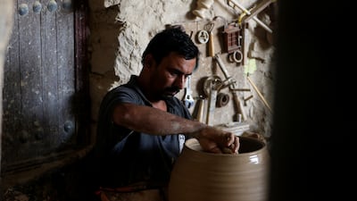 A worker makes a vase at Jaffar Mohd Al Shughul Pottery's centre in Al A'ali, Bahrain. All photos by Reuters