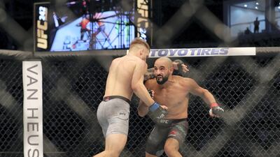 Abu Dhabi, United Arab Emirates - September 07, 2019: Lightweight bout between Teemu Packalen and Ottman Azaitar (black shorts, winner) in the Prelims at UFC 242. Saturday the 7th of September 2019. Yas Island, Abu Dhabi. Chris Whiteoak / The National