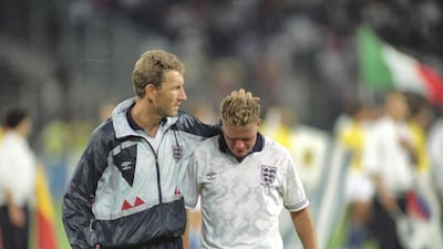 Terry Butcher (left) of England consoles team mate Paul Gascoigne after the World Cup semi-final against West Germany at the Delle Alpi Stadium in Turin, Italy. Allsport UK