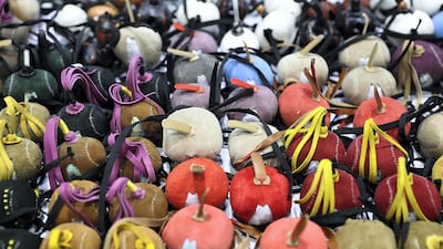 Falcon caps on display at Adihex. Pawan Singh / The National