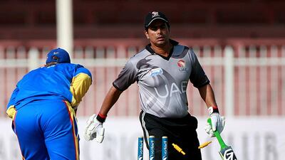 Saqib Ali, right, of the UAE was run out by Jean Pierre Kotze of Namibia during their match at the Sharjah Cricket Stadium on September 29, 2013. Satish Kumar / The National