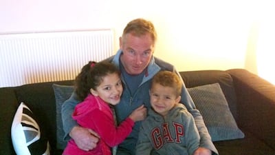 Steve Grant with grandchildren Aisha and Faris Al Barwani. The grandfather has now returned to the UK. Courtesy Portsmouth News