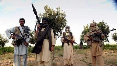 Taliban militants pose for a picture in southern Afghanistan. Some consider them heroes fighting against outsiders, others see them as terrorists.