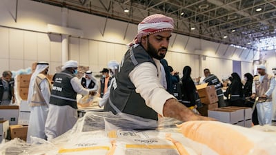 Emiratis, residents, children and people of determination came together on Saturday to help sort donations for families affected by the devastating flash floods in Pakistan. All photos: Issa Alkindy for The National