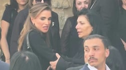 A screengrab shows Queen Rania of Jordan visiting mourners in the village after the church attack